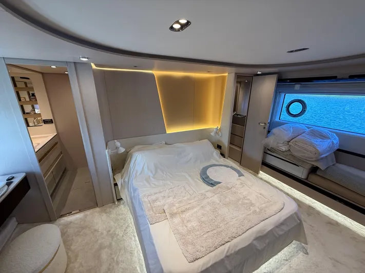  Yacht Photos Pics Luxurious bedroom interior of 2021 Azimut Fly 78 yacht with modern design and ambient lighting.