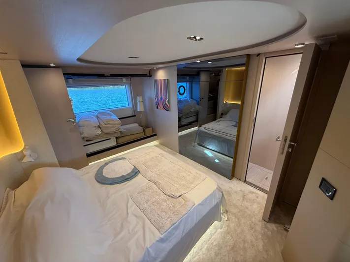  Yacht Photos Pics Luxurious bedroom interior of 2021 Azimut Fly 78 yacht with modern design and ocean view.