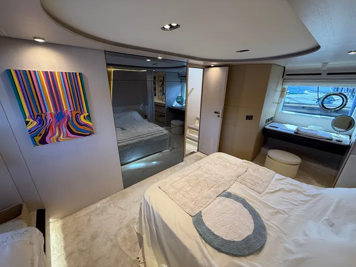  Yacht Photos Pics Luxurious interior of 2021 Azimut Fly 78 yacht, featuring modern bedroom and vibrant artwork.
