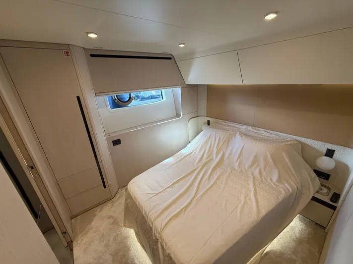  Yacht Photos Pics Luxurious bedroom interior of 2021 Azimut Fly 78 yacht with modern design and cozy ambiance.