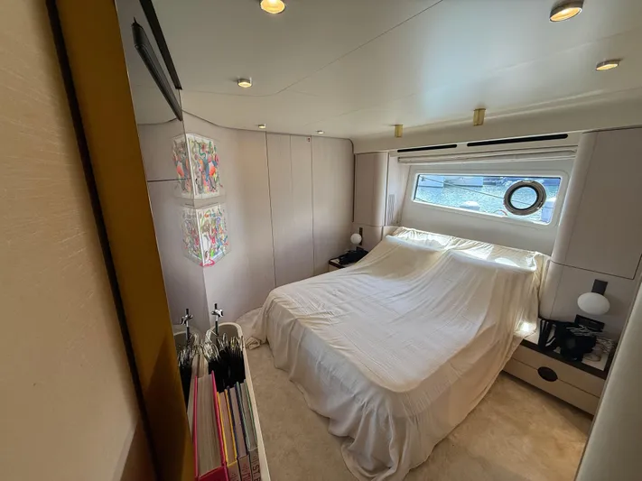  Yacht Photos Pics Luxurious bedroom interior of 2021 Azimut Fly 78 yacht with elegant decor and natural light.