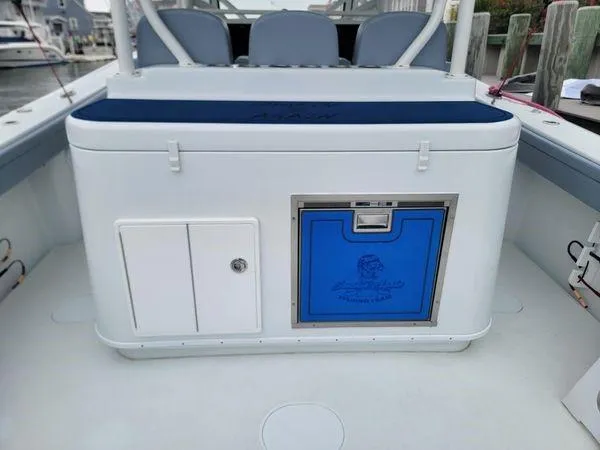 Yacht Photos Pics 2022 Yellowfin 42 Offshore boat interior with storage compartments and seating.