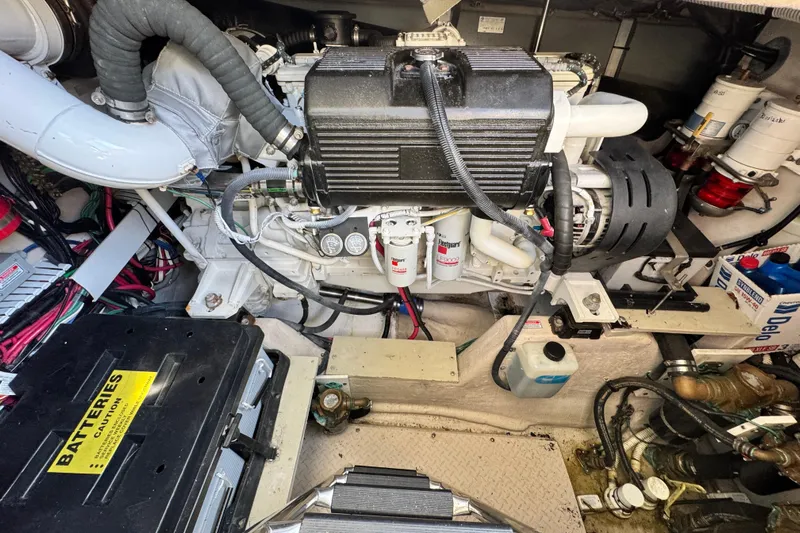  Yacht Photos Pics Engine room of 2006 Sea Ray 48 Sundancer with visible components and battery.