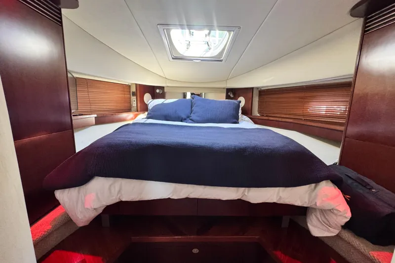  Yacht Photos Pics Luxurious cabin interior of 2006 Sea Ray 48 Sundancer yacht with cozy bedding.