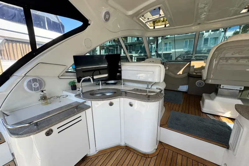  Yacht Photos Pics Luxurious interior of 2006 Sea Ray 48 Sundancer yacht with modern amenities and sleek design.