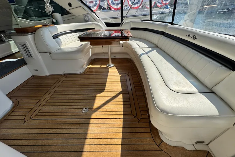  Yacht Photos Pics Luxurious 2006 Sea Ray 48 Sundancer yacht interior with elegant seating and wooden flooring.