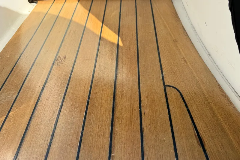  Yacht Photos Pics Teak deck of 2006 Sea Ray 48 Sundancer yacht, showcasing elegant wood finish.