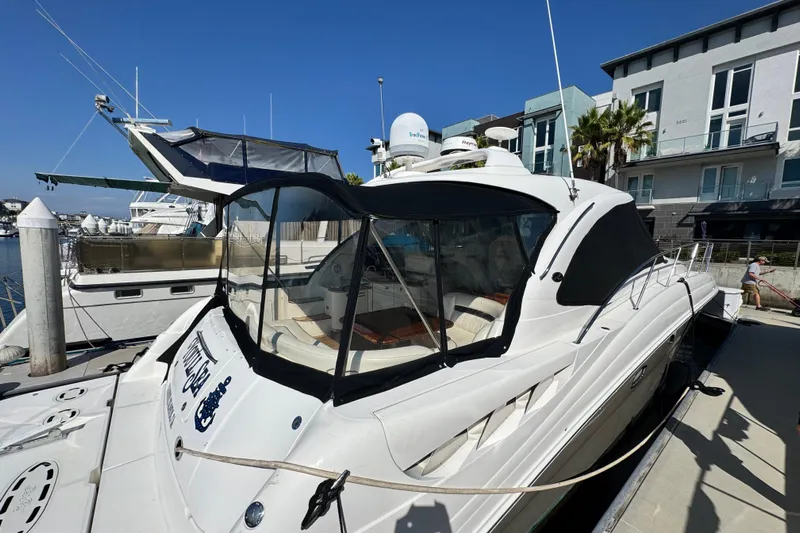  Yacht Photos Pics 2006 Sea Ray 48 Sundancer yacht docked at marina, featuring sleek design and modern amenities.