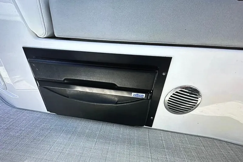  Yacht Photos Pics 2022 Regal 28 Express interior detail with storage compartment and speaker.