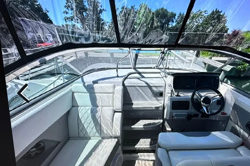  Yacht Photos Pics 2022 Regal 28 Express boat interior with modern helm and seating.