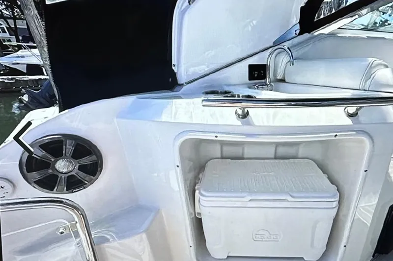  Yacht Photos Pics 2022 Regal 28 Express boat interior with cooler and speaker.