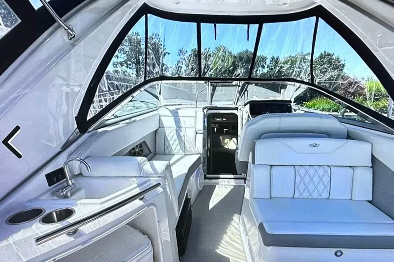  Yacht Photos Pics 2022 Regal 28 Express boat interior with luxurious seating and modern amenities.