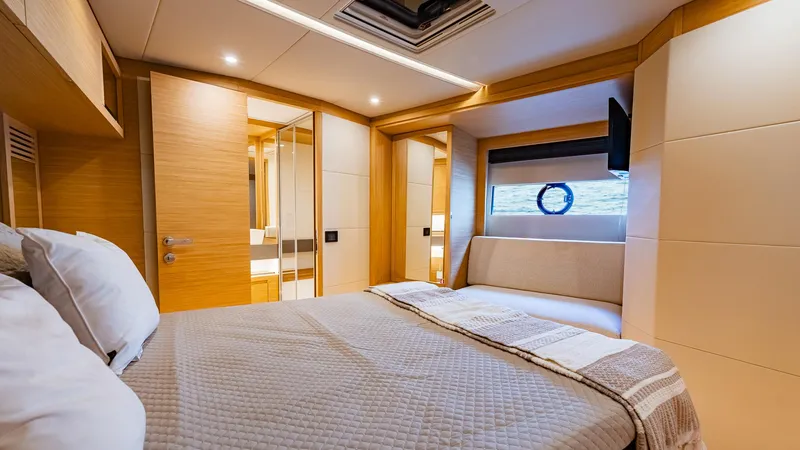 Available Now Yacht Photos Pics Luxurious cabin interior of 2024 Pardo Yachts GT52, featuring modern design and cozy bedding.