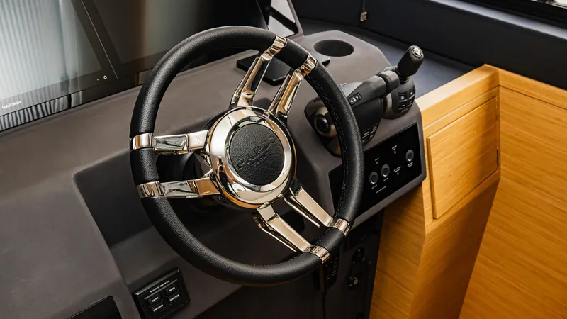 Available Now Yacht Photos Pics Steering wheel and controls of 2024 Pardo Yachts GT52, showcasing luxury design.