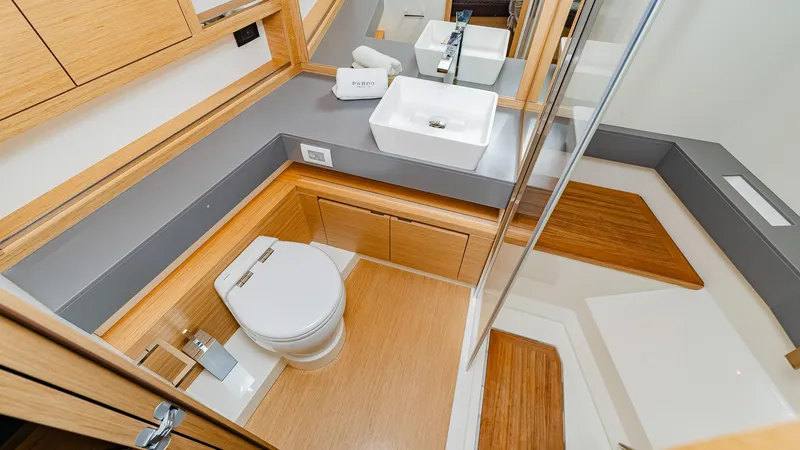 Available Now Yacht Photos Pics Luxurious bathroom in 2024 Pardo Yachts GT52, featuring modern fixtures and elegant wood accents.