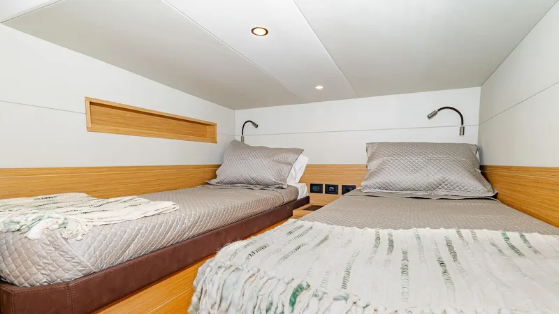 Available Now Yacht Photos Pics 2024 Pardo Yachts GT52 cabin with twin beds and modern lighting.