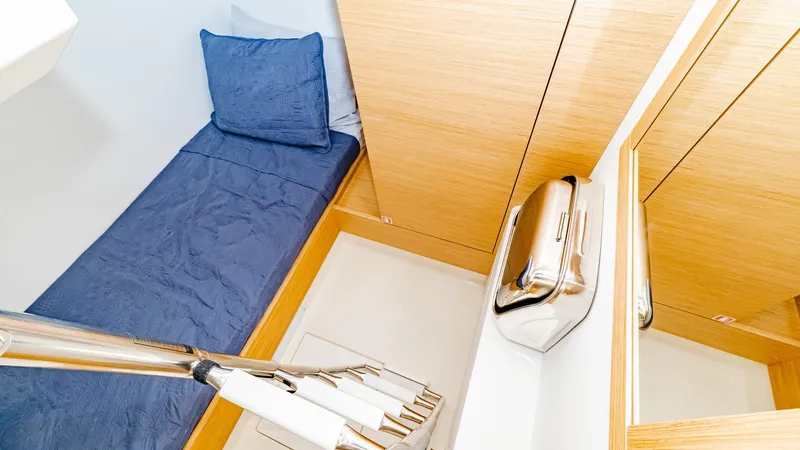 Available Now Yacht Photos Pics 2024 Pardo Yachts GT52 interior cabin with blue bedding and wooden accents.
