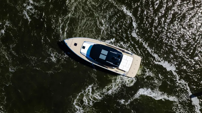 Available Now Yacht Photos Pics Aerial view of 2024 Pardo Yachts GT52 cruising on dark water.