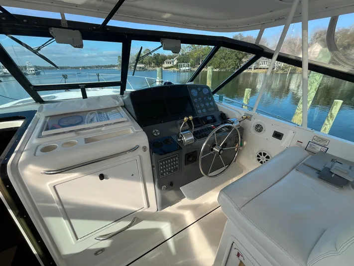  Yacht Photos Pics 2001 Tiara Yachts 4100 Open helm with steering wheel and navigation controls.