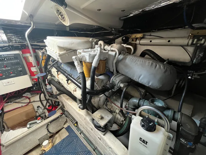  Yacht Photos Pics Engine room of 2001 Tiara Yachts 4100 Open, featuring CAT machinery and control panel.
