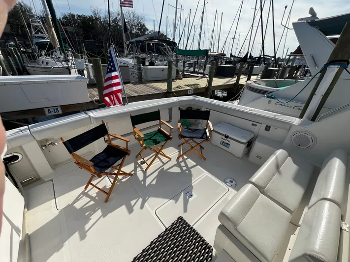  Yacht Photos Pics 2001 Tiara Yachts 4100 Open deck with chairs, docked at marina.