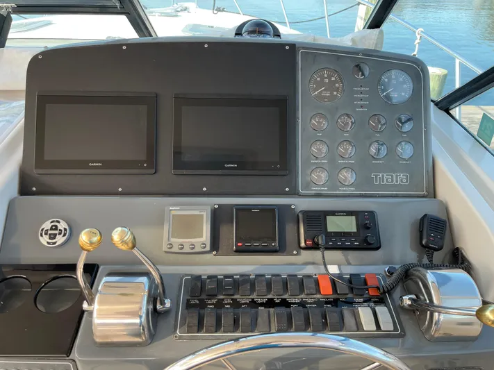  Yacht Photos Pics Control panel of 2001 Tiara Yachts 4100 Open with navigation screens and gauges.