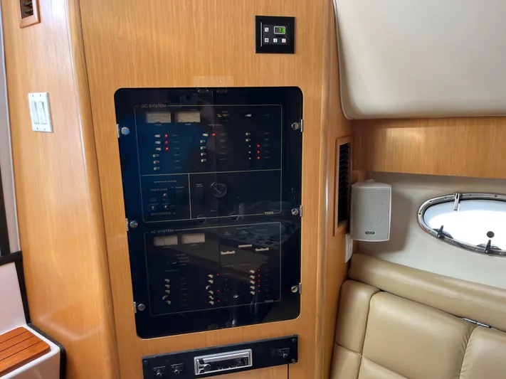  Yacht Photos Pics Control panel inside 2001 Tiara Yachts 4100 Open, featuring wood finish and leather seating.