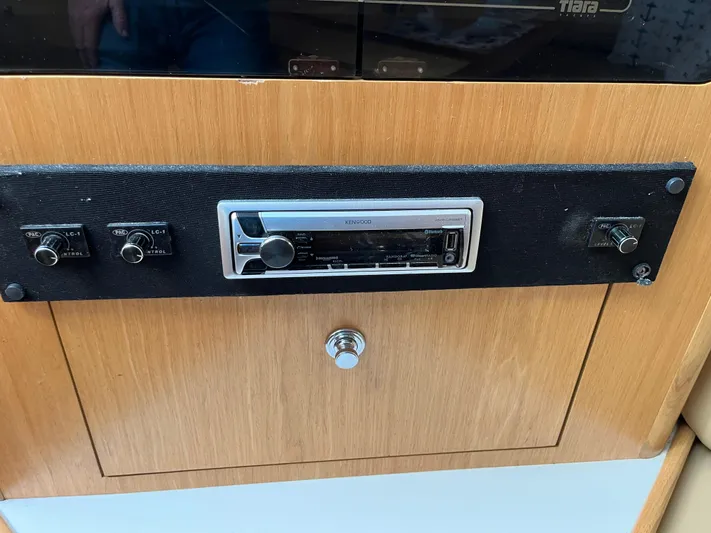  Yacht Photos Pics Control panel of a 2001 Tiara Yachts 4100 Open, featuring a stereo system.