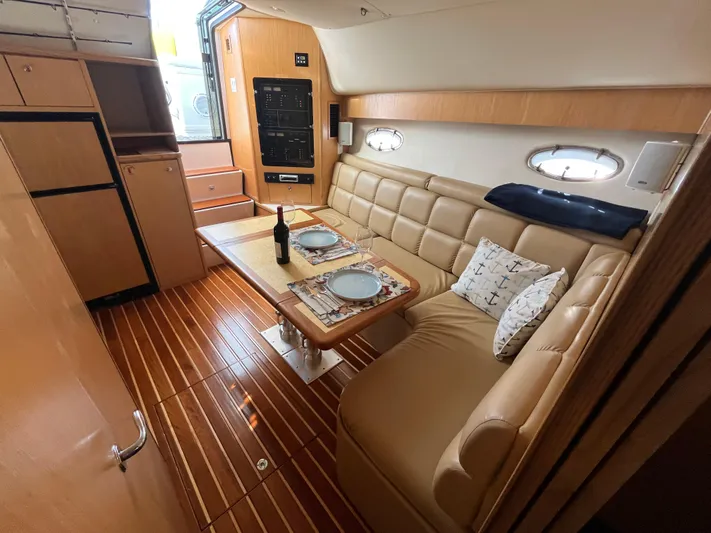  Yacht Photos Pics Interior of 2001 Tiara Yachts 4100 Open with elegant seating and dining area.