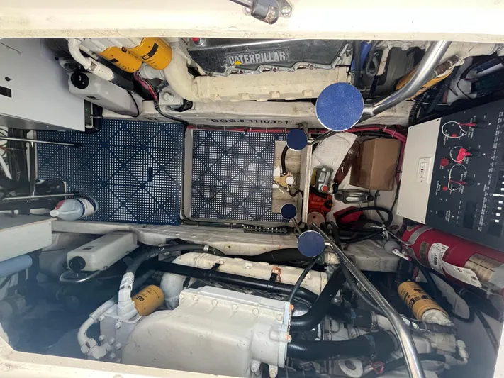  Yacht Photos Pics Engine room of 2001 Tiara Yachts 4100 Open, showcasing mechanical components and wiring.