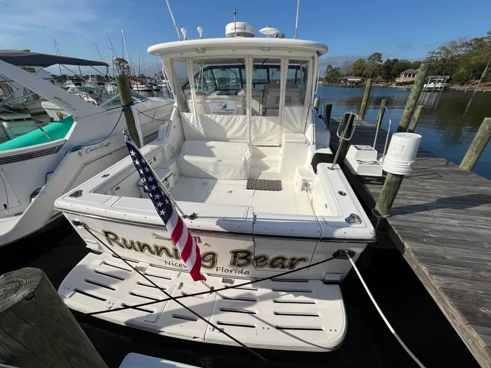  Yacht Photos Pics Tiara Yachts 4100 Open 2001 docked, displaying "Running Bear" name and American flag.