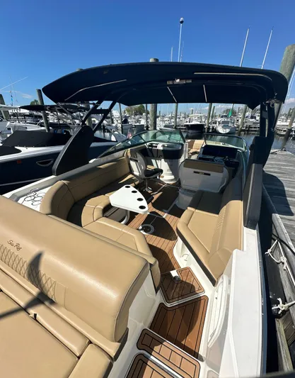 Yacht Photos Pics 2019 Sea Ray SLX 280 boat with tan seating and sleek design, docked at a marina.
