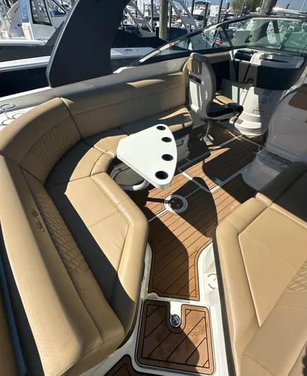  Yacht Photos Pics 2019 Sea Ray SLX 280 boat interior with tan seating and wooden flooring.