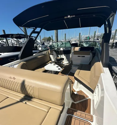  Yacht Photos Pics 2019 Sea Ray SLX 280 boat with tan seating and sleek design at a marina.