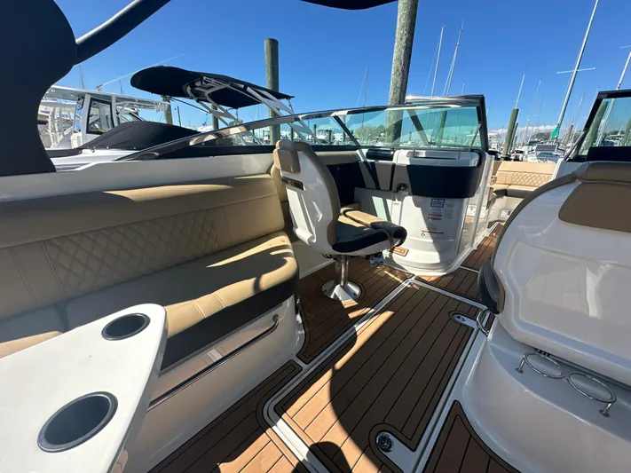  Yacht Photos Pics 2019 Sea Ray SLX 280 boat interior with tan seating and wooden flooring.