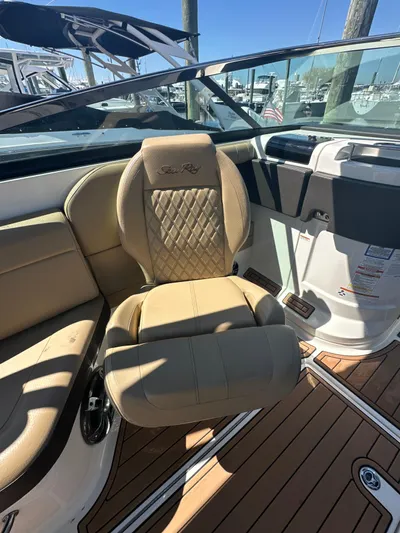  Yacht Photos Pics 2019 Sea Ray SLX 280 boat interior with tan seating and wood flooring.