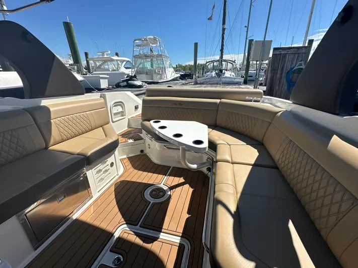  Yacht Photos Pics 2019 Sea Ray SLX 280 boat interior with tan seating and wooden deck.