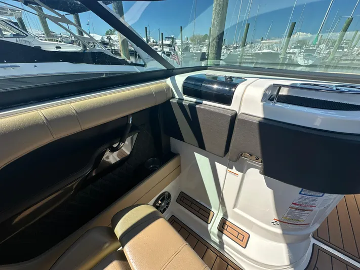  Yacht Photos Pics Interior view of 2019 Sea Ray SLX 280 boat with tan seating and dashboard.