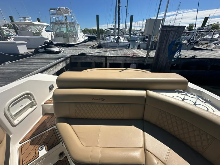  Yacht Photos Pics 2019 Sea Ray SLX 280 boat interior with tan seating at marina.