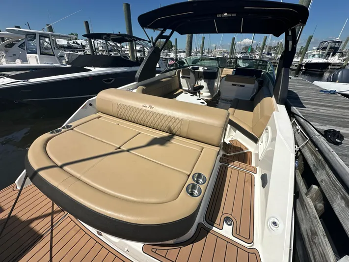  Yacht Photos Pics 2019 Sea Ray SLX 280 boat with tan seating, docked at a marina.