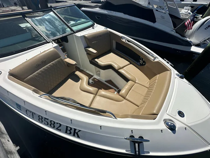  Yacht Photos Pics 2019 Sea Ray SLX 280 boat with tan leather seating, docked at a marina.