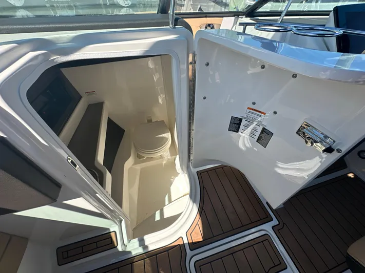  Yacht Photos Pics 2019 Sea Ray SLX 280 boat interior with open cabin door and visible toilet.