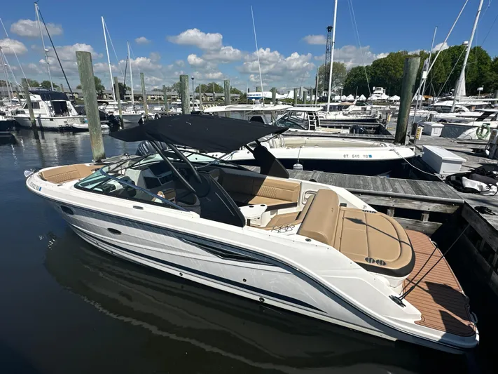  Yacht Photos Pics 2019 Sea Ray SLX 280 boat docked at marina under clear blue sky.
