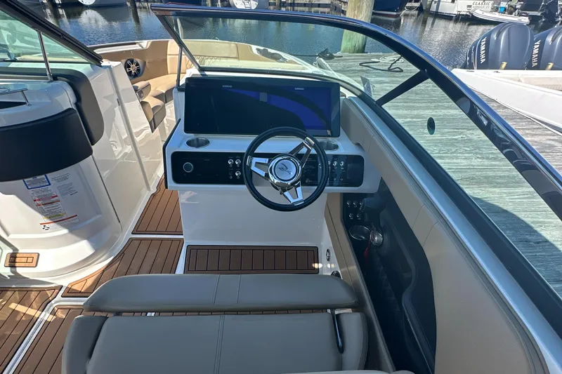 Yacht Photos Pics 2019 Sea Ray SLX 280 boat cockpit with steering wheel and dashboard, docked at marina.
