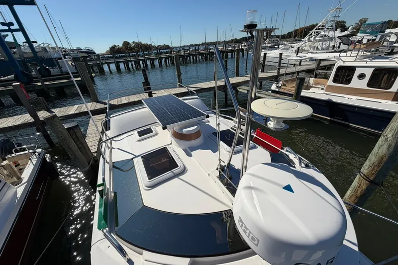 Getting There Yacht Photos Pics 2023 Ranger Tugs R-25 boat docked, featuring solar panels and navigation equipment.
