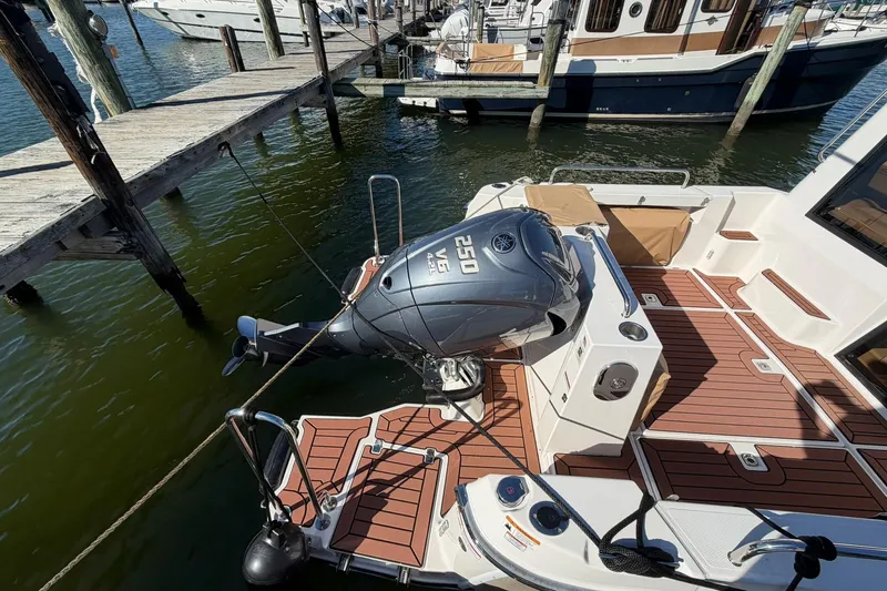 Getting There Yacht Photos Pics 2023 Ranger Tugs R-25 boat with Yamaha 250 engine docked at marina.