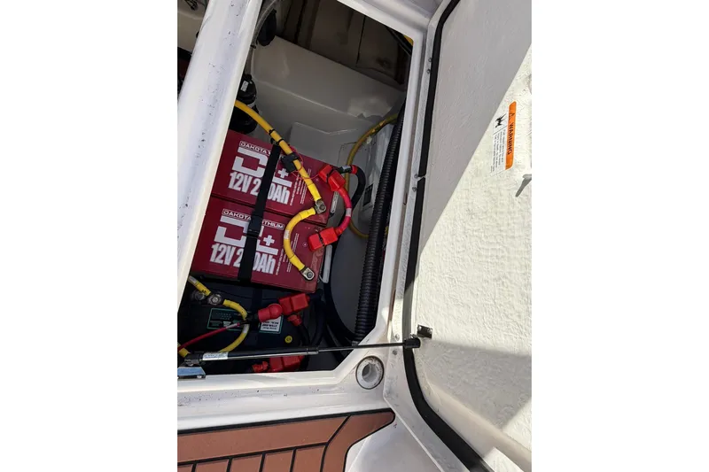 Getting There Yacht Photos Pics Battery compartment of 2023 Ranger Tugs R-25 boat with visible wiring and components.