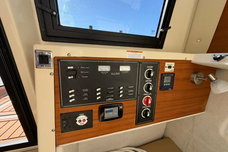 Getting There Yacht Photos Pics Control panel of 2023 Ranger Tugs R-25 boat, featuring switches and gauges.