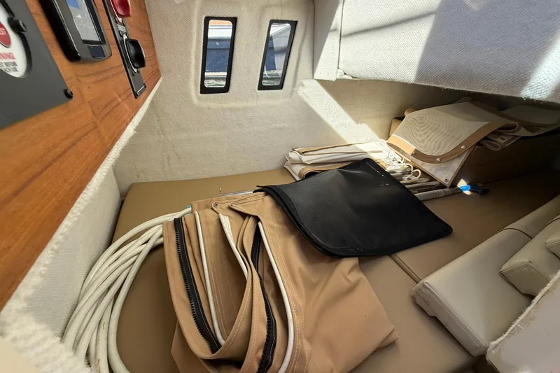Getting There Yacht Photos Pics Interior cabin of 2023 Ranger Tugs R-25 with storage and equipment.