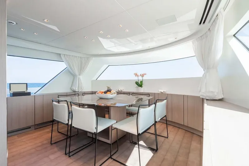  Yacht Photos Pics Luxurious dining area on 2024 Sanlorenzo SX76 yacht with panoramic ocean views.